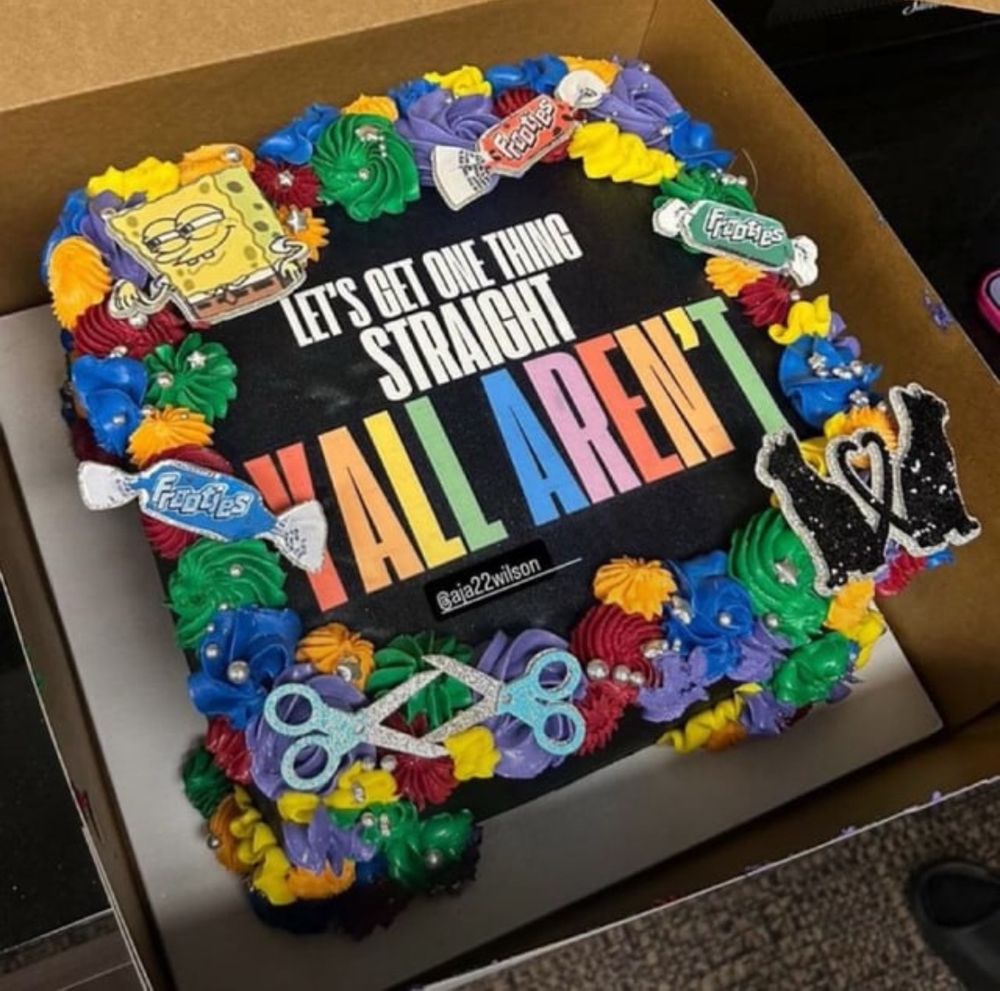 A’ja Wilson’s 2025 Pride cake reads “let’s get one thing straight yall aren’t”

The cake is piped with rainbow rosettes and super gay decorations around the edge: two pairs of scissors, frooties candies, two black cats with intertwined tails, and a limp-wristed SpongeBob