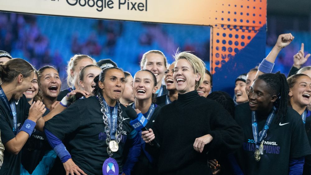 Marta stands on the championship stage getting interviewed by Lori Lindsey. She just dropped the f-bomb on live network television. Everyone is laughing hysterically 