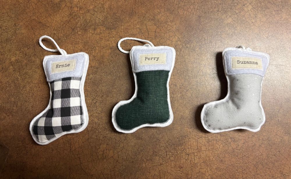 Three fabric Christmas stockings were made by a lady from Patti’s Infant Loss Group, ParentCare for Patti.