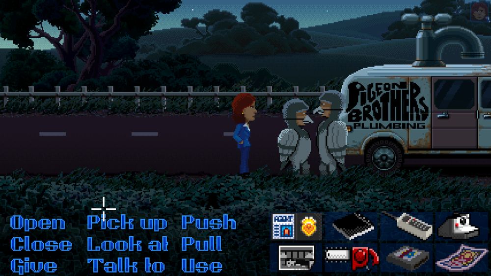 A screenshot of Thimbleweed Park. Agent Ray stands by the Pigeon Brothers. There's a list of verbs on the bottom of the screen, they are arranged in a grid of 3 by 3 words.