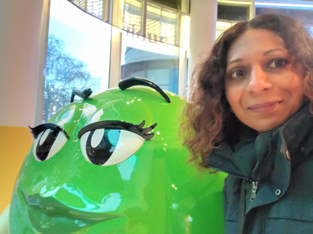 Selfie of Saher and a happy green M&M