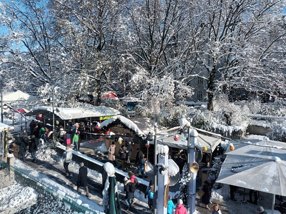 A photo of a snowy Christmas market