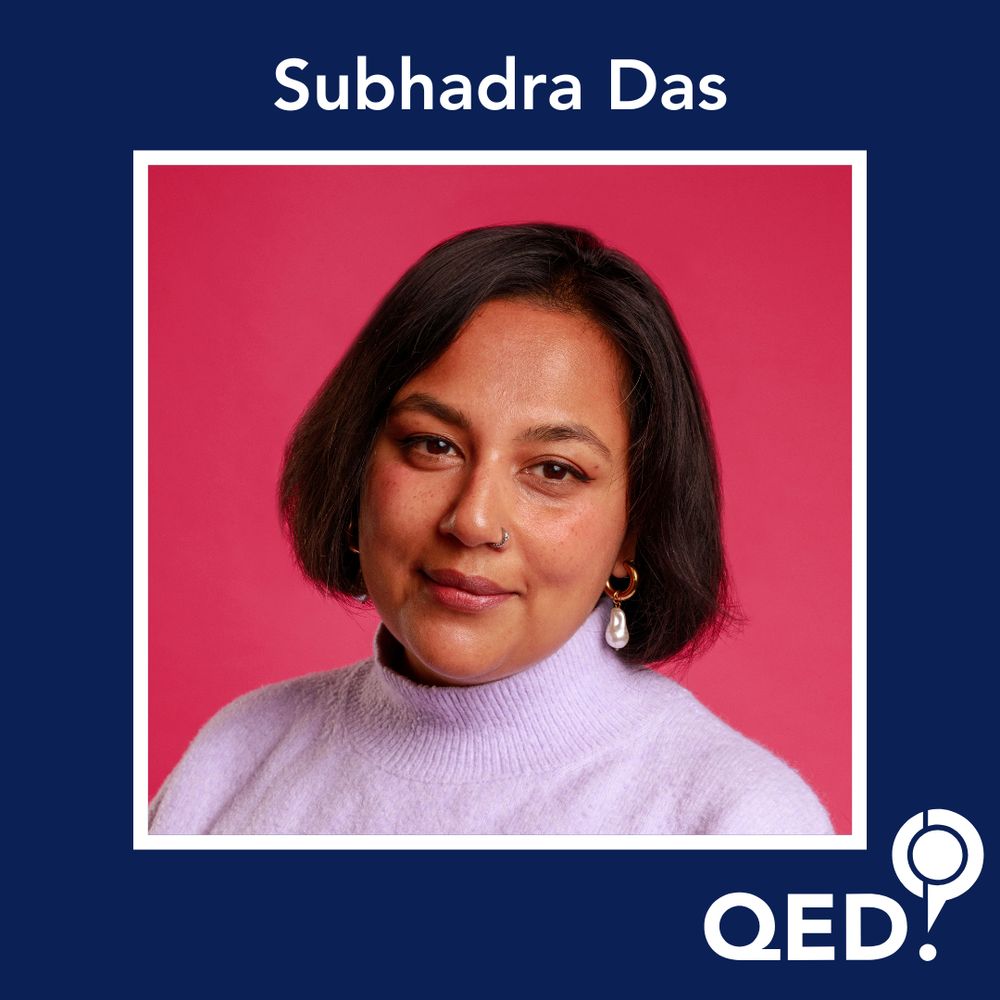 Subhadra Das - a brown woman with a brown bob, she's wearing a lilac turtleneck jumper, a nose ring and pearl dangly earrings. 