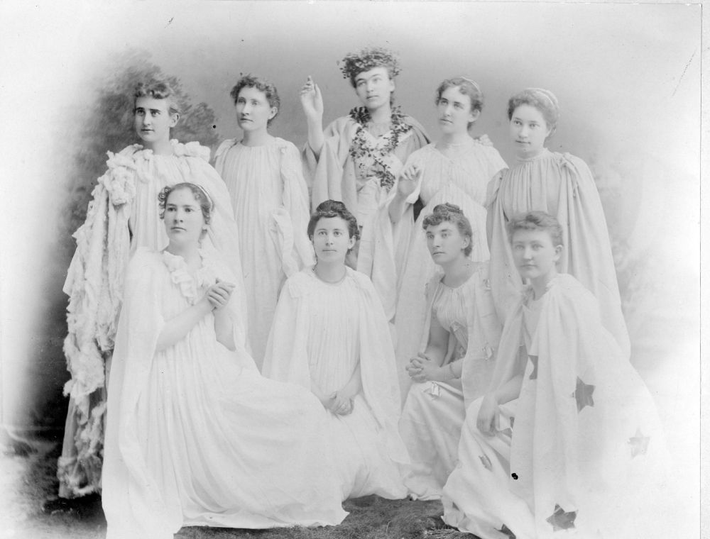 Group of women in flowing robes. One woman has a garland of plants around her head and neck. 1890s. University of Northern Colorado Archives and Special Collections.  