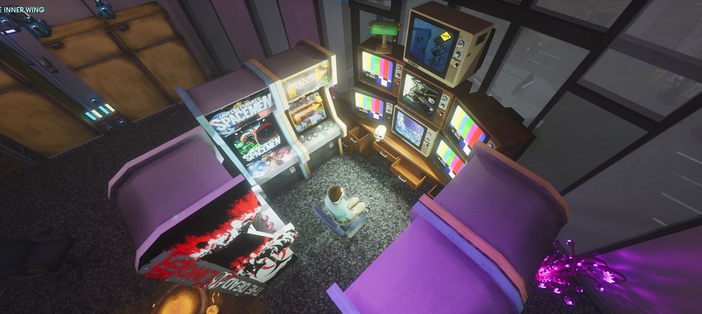 A screenshot from the game Abiotic Factor. A top down camera angle showing a player character scientist sitting in a chair surrounded by arcade machines and stacked televisions. All of the machines and tvs are on emitting bright light.