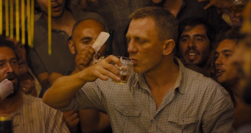 Bond drinks a shot of tequila with a scorpion on his hand in Skyfall