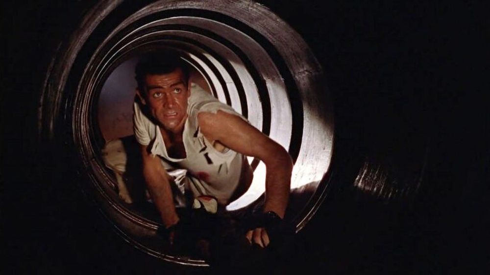 James Bond crawling in a vent in Dr No