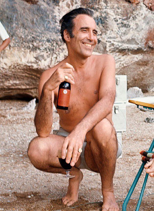 Christopher Lee on the beach with booze