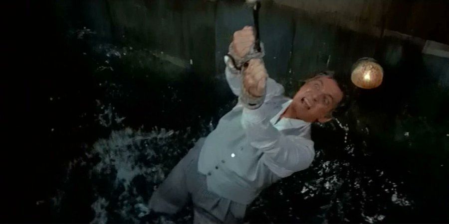 Felix being fed to a shark in LTK