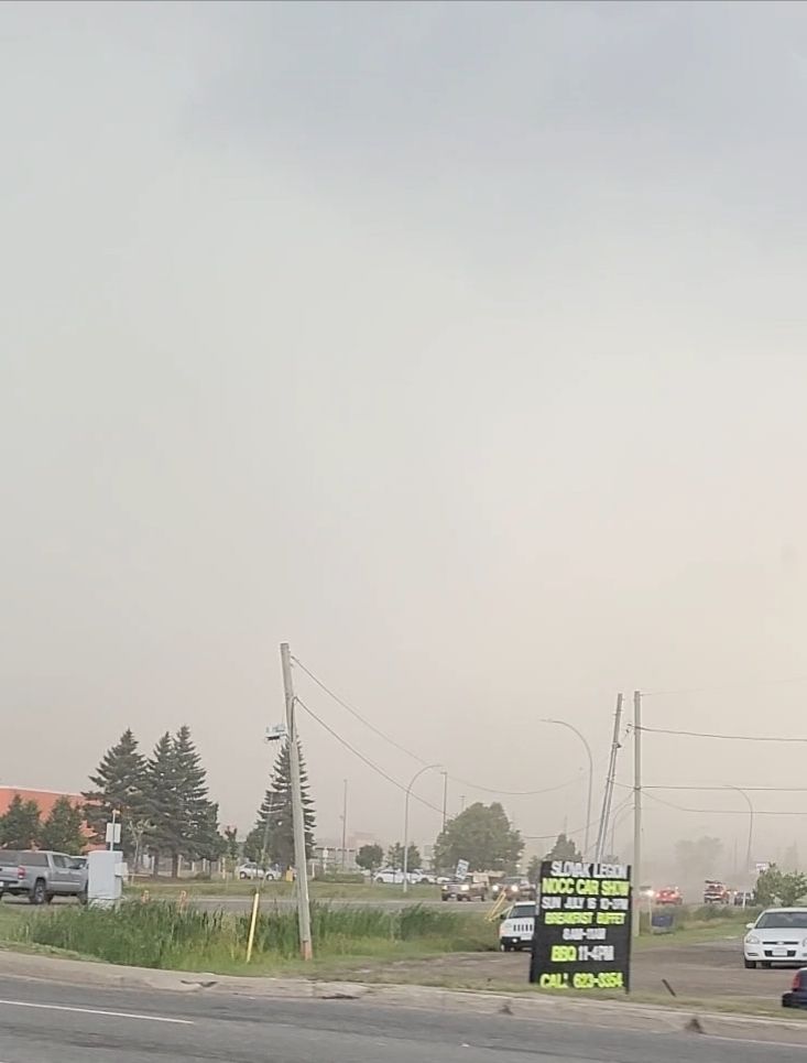 Another view of dust in the air from the thunderstorm inflow. You cannot see the sky or buildings in the distance because of it.
