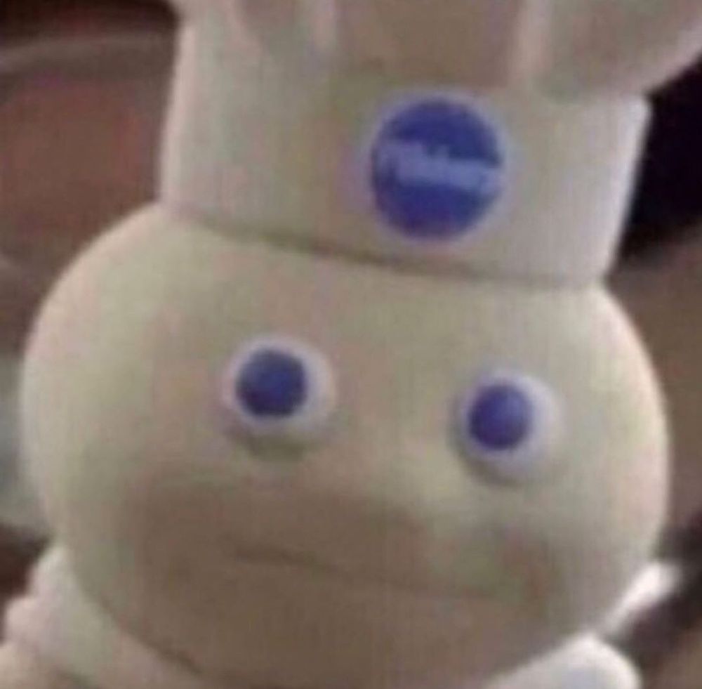The pillsbury doughboy with a menacing and concerned stare