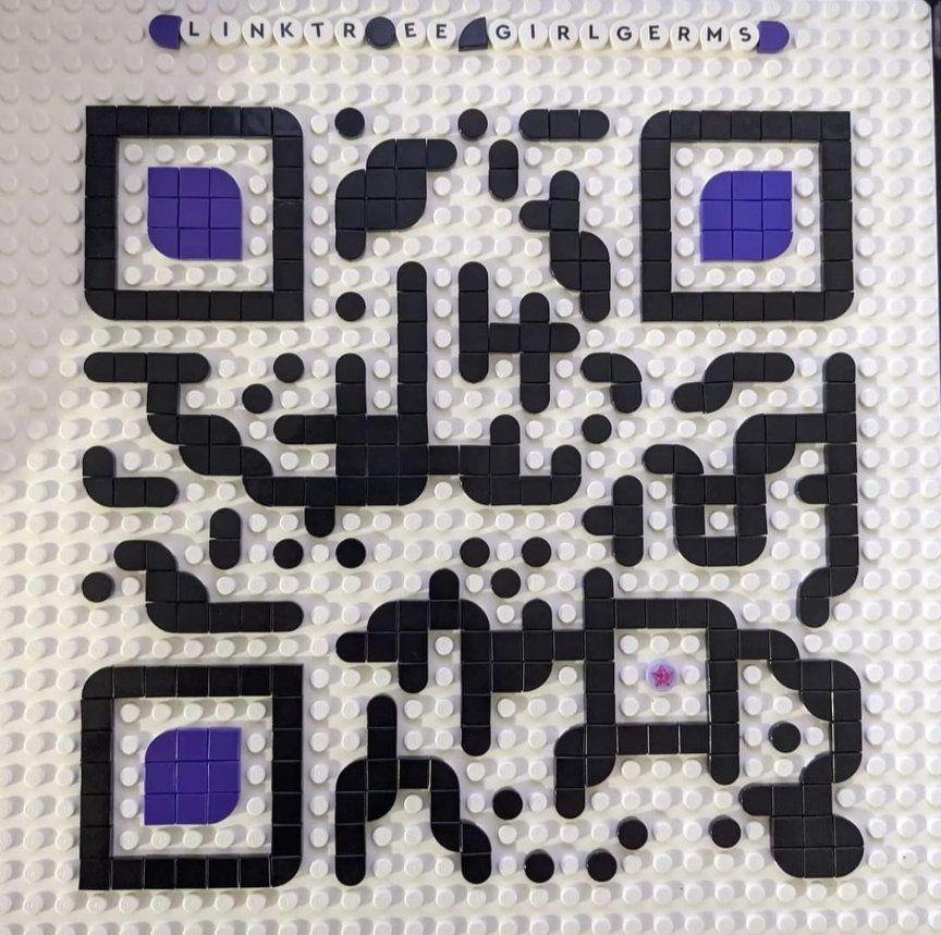 Lego created QR Code in black and purple on a white background, taking the user to linktr.ee/girlgerms