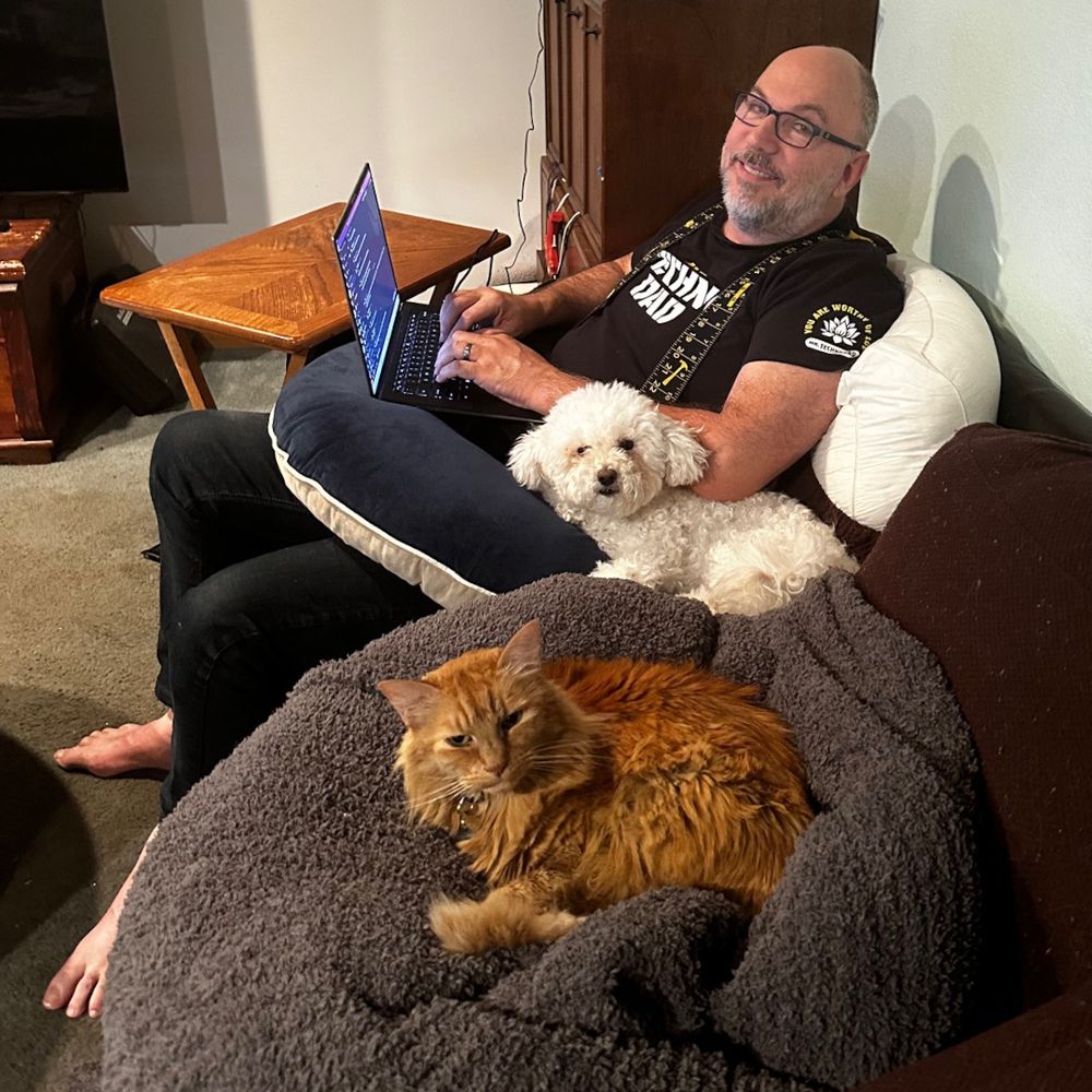 Mr. Technodad, Floof, and Pumpkin hang out on the couch.