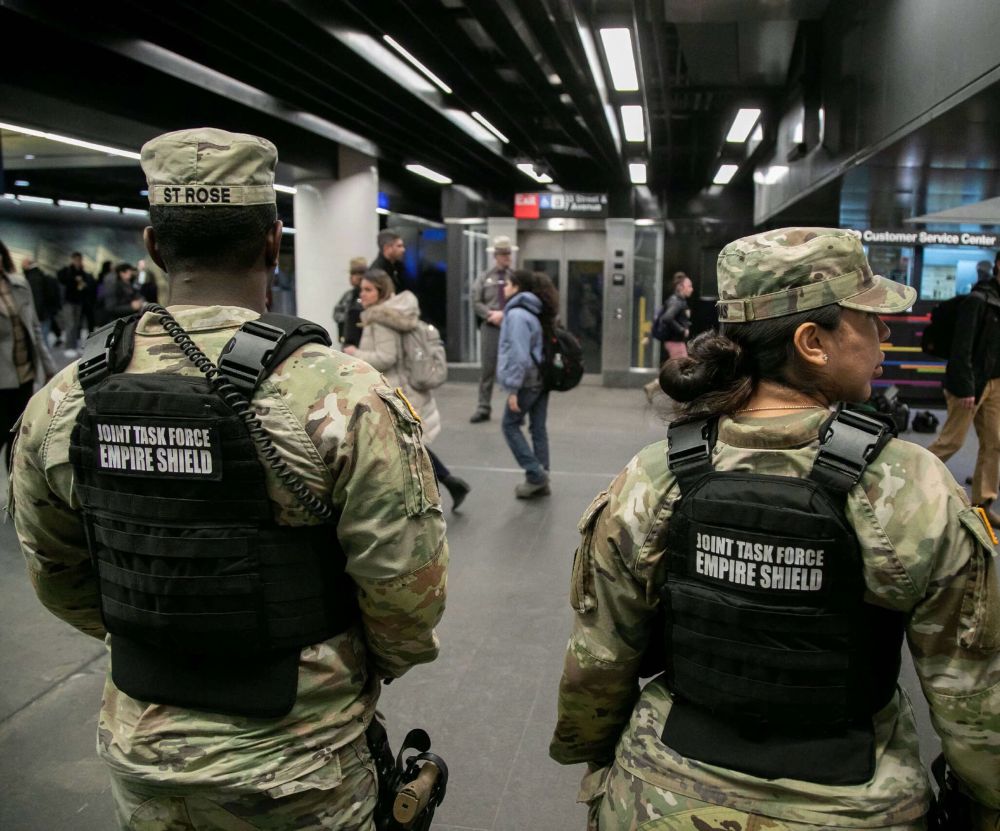 2 USAF soldiers in uniforms and vests