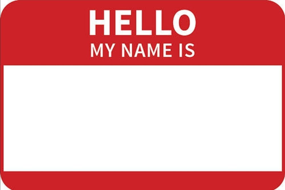 Red name tag stating: Hello my name is. Bellow is a white box for a name to be written in.