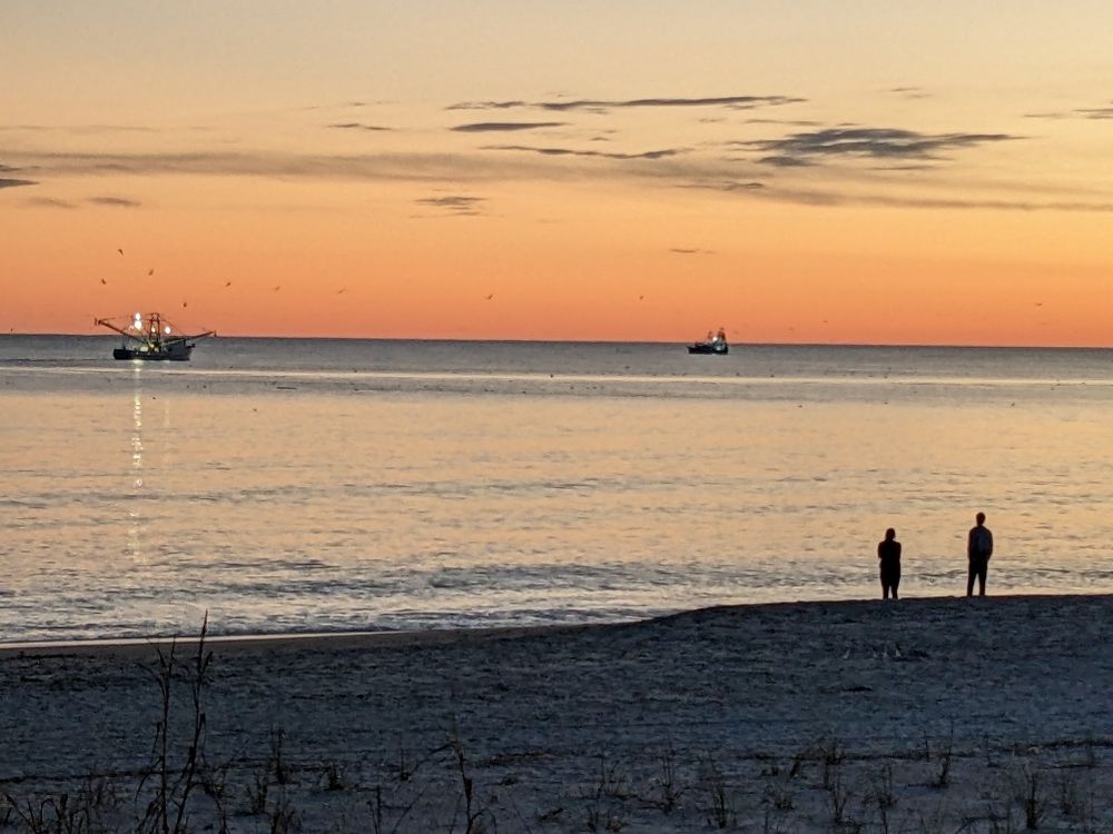 Sunset on Oak Island Beach, N.C., looking out to the Atlantic Ocean. This is one spot where, in the winter, you can see both the sunrise and sunset looking out from the beach. 