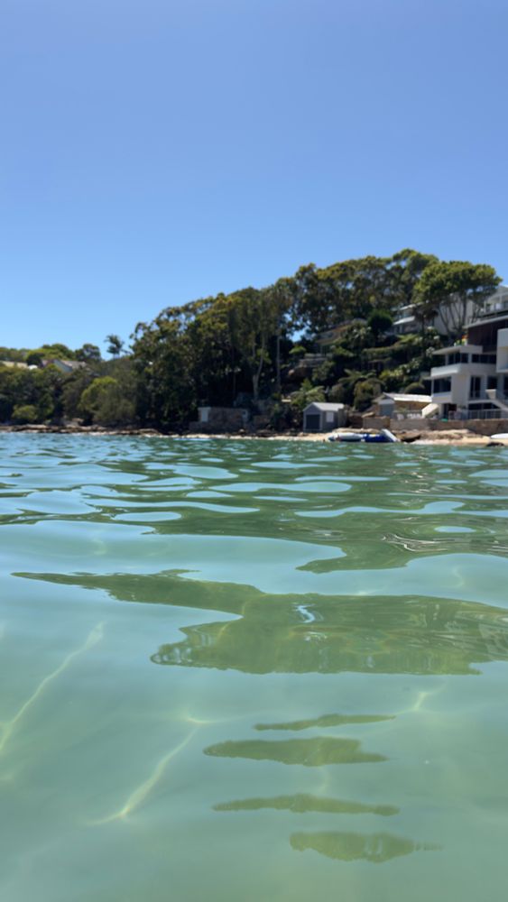 Swimmers view of clear blue sea water