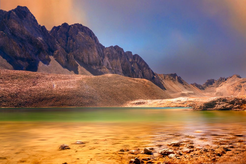 Sloan lake in it's multi-colors against American Basin mountains. High altitude at almost 13,000ft.