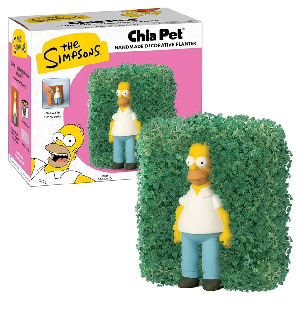 Color photo of a chia pet planter that shows Homer Simpson against a wall. When watered, the wall grows sprouts that recreates the classic “Homer backing into a hedge” scene.