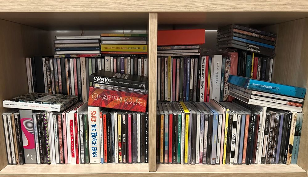 too many cds for a tiny shelf 