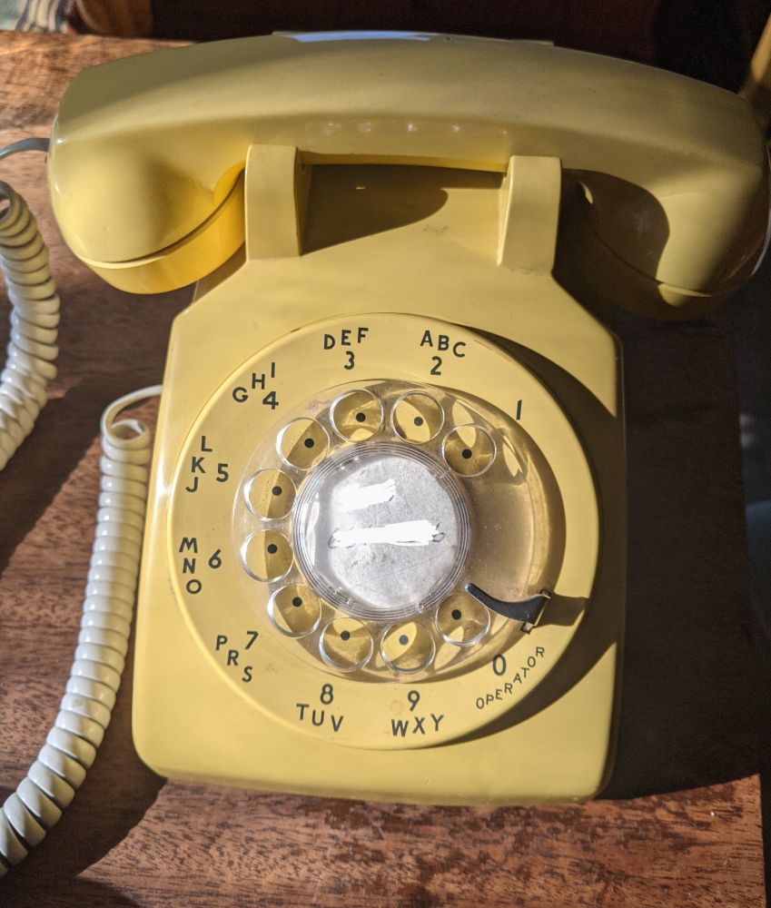 70s(?) vintage mustard yellow rotary phone made by Western Electric (Bell System Property Not For Sale)