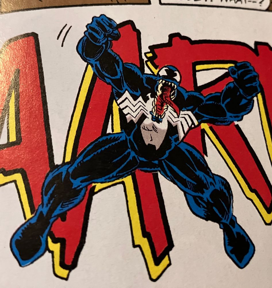photo of a comic book page depicting Venom yelling and balling his fists
