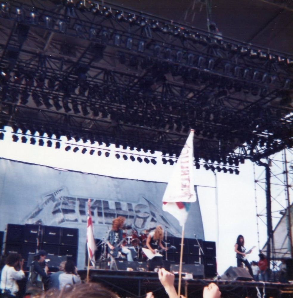 Fuzzy photo of Metallica at Castle Donington August 1985. Cliff and James giein it laldy.