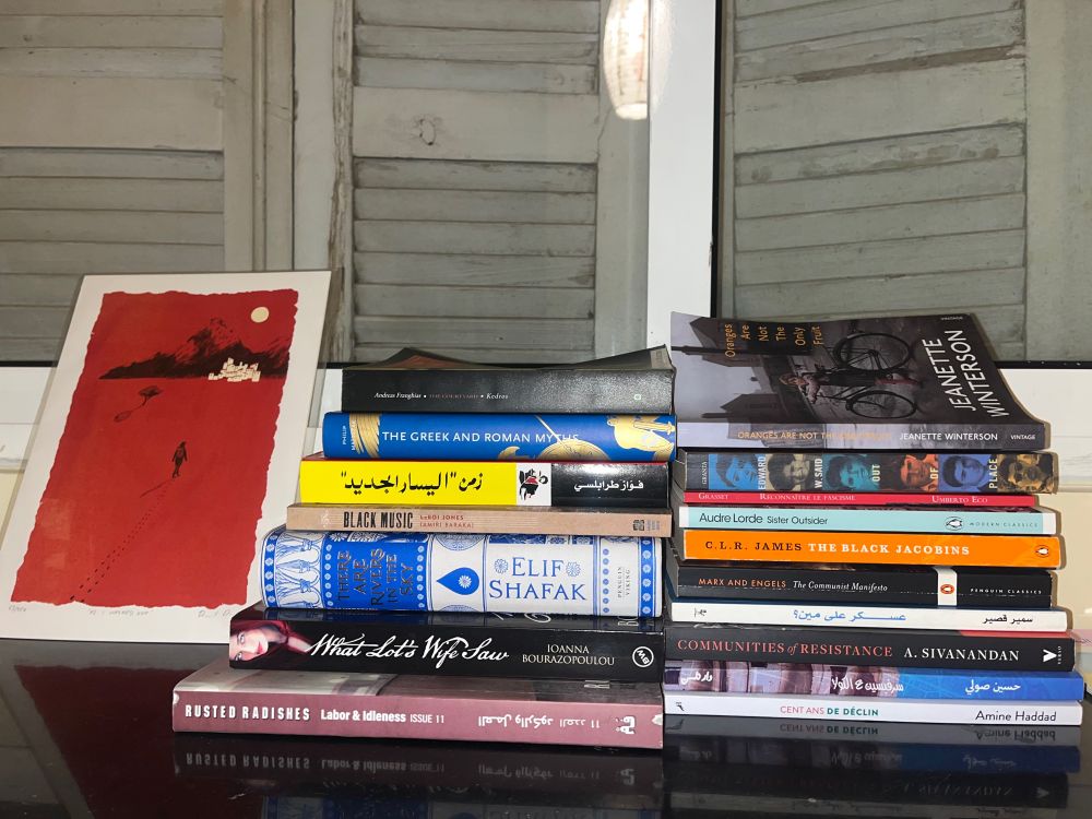 Piles of books inluding Shafak, Baraka, Lorde, Marx, CLR James, Edward Said, Fawaz Traboulsi, Samir Kassir, Winterson and more