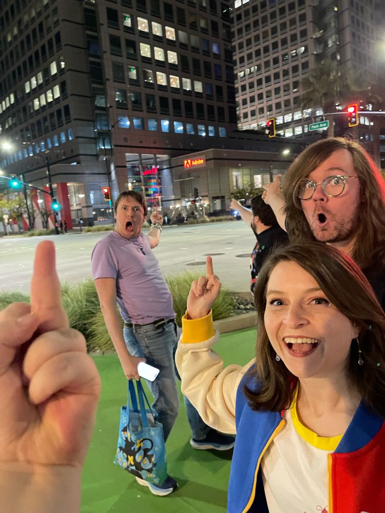 A bunch of friends giving the Adobe building the single finger salute