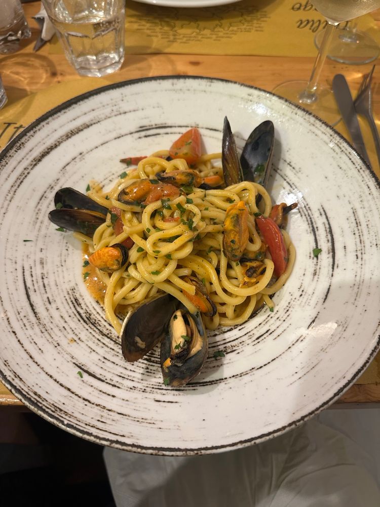 A plate of Spaghetti alle Cozze. Spaghetti with Mussels. 