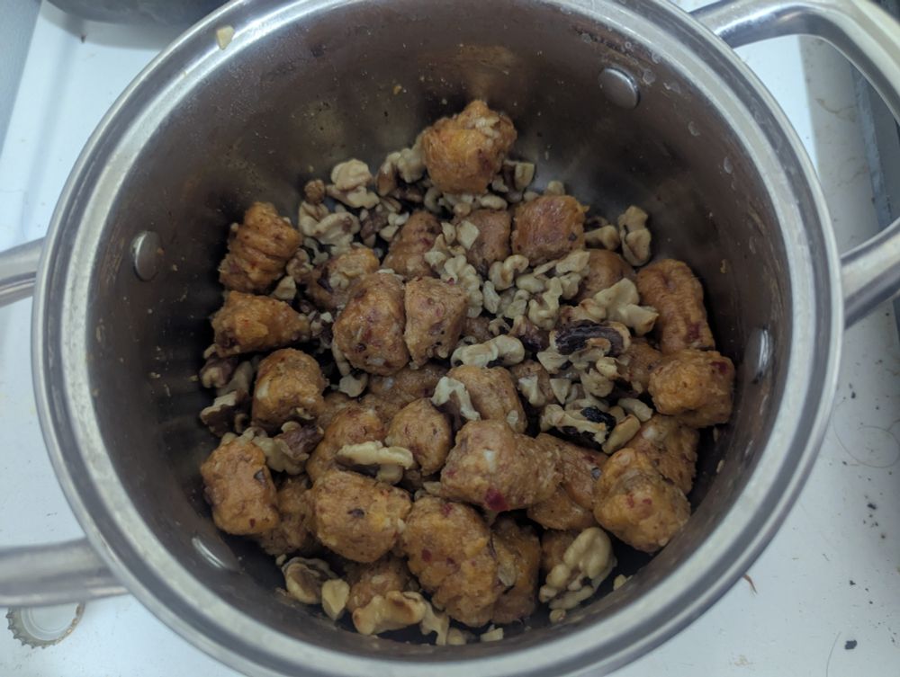 Gnocchi and walnuts in a pan.

Further thoughts
---
Due to the short cooking time, the garlic is mostly raw. Blanche or roast first if you don't like that strong a flavor. 

These would probably pair well with fresh mozzarella, spinach/basil, and a hearty tomato sauce... but I didn't have those handy.