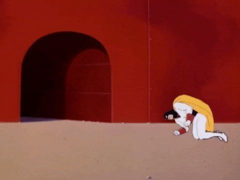 Space Ghost curled up in a fetal ball on the ground 