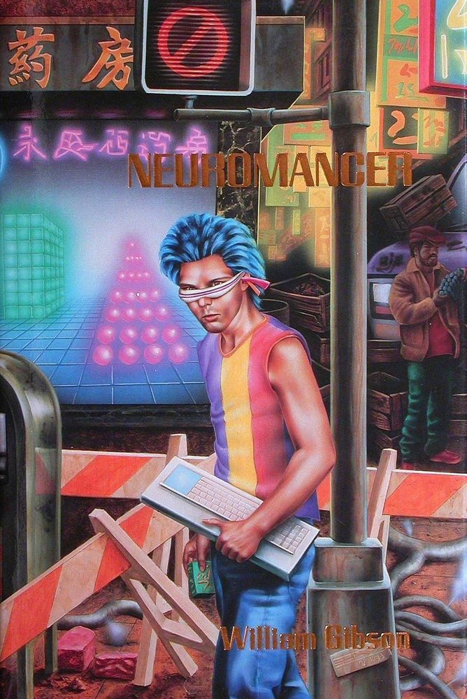 cover for the 1986 limited edition of William Gibson's 'Neuromancer' from Phantasia Press.  a figure with spiky blue hair wearing a purple, yellow and red striped tank top & a pair of Geordie LaForge style glasses, carrying a large computer keyboard past a bright neon colored sign and various construction barriers 