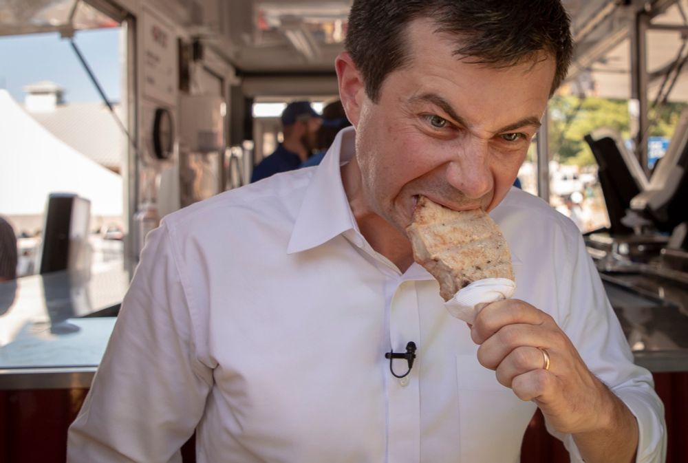 Mayo Pete Buttigieg eating some fair food looking like a mfing rat