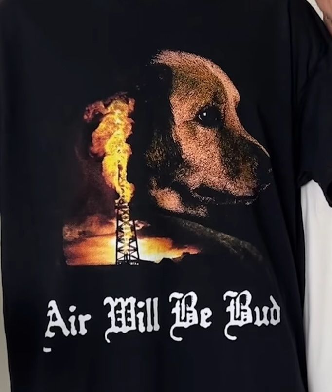 tee shirt in the style of PT Anderson's 'There Will Be Blood' poster but featuring a golden retriever and titled 'Air Will Be Bud', referencing the famous basketball playing dog from the Air Bud franchise 