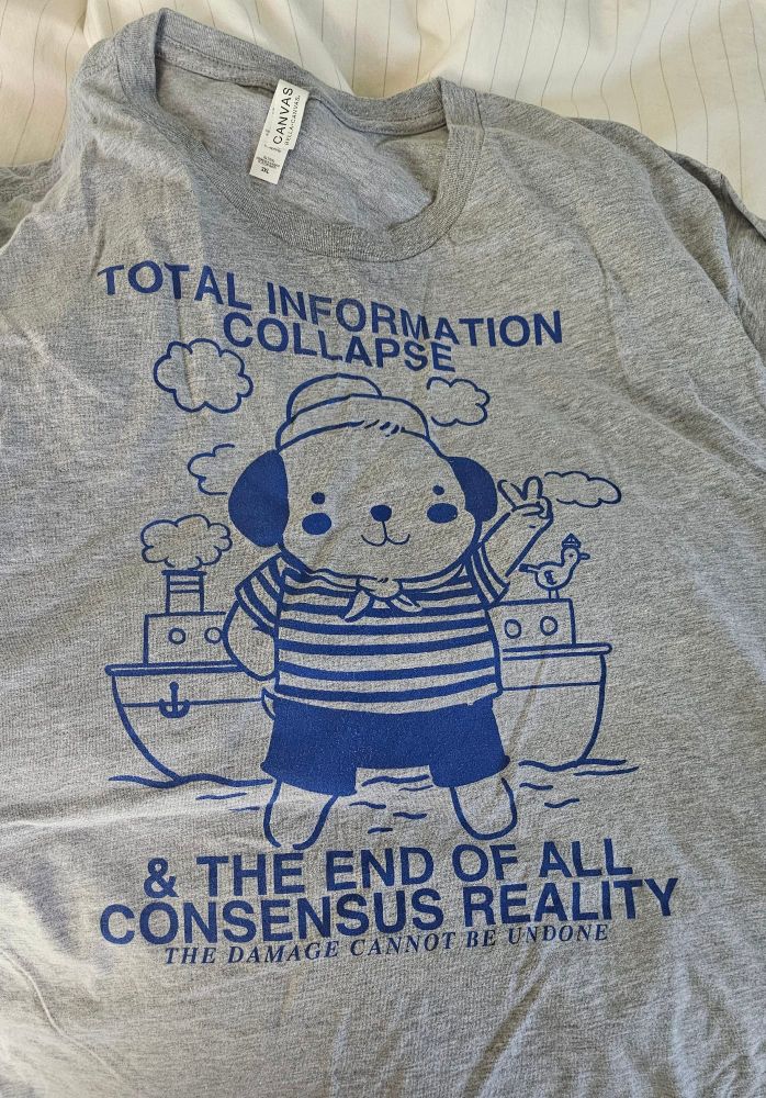 a happy sailor dog proclaiming 
TOTAL INFORMATION COLLAPSE & THE END OF ALL CONSENSUS REALITY 
the damage cannot be undone