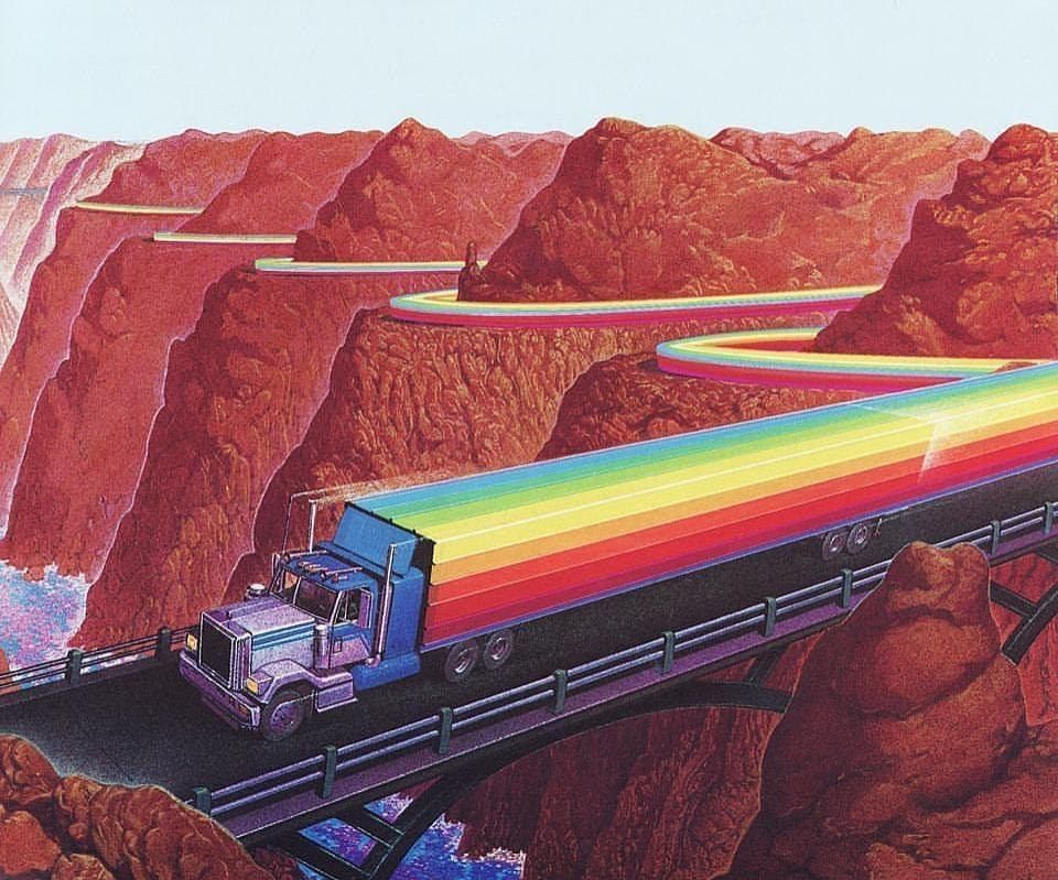 A semi truck trailing a rainbow down  a curvy mountain road