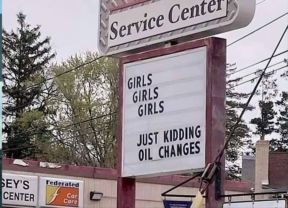 service center sign reading 

girls 
girls 
girls

just kidding
oil changes 