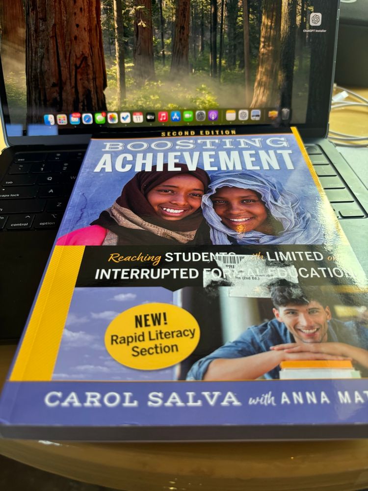Second edition of Boosging Achievement with a pair of students at the top in hijab and a student in the bottom right corner resting on books