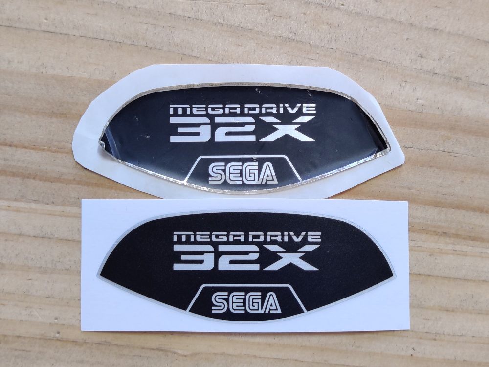 Comparison of the original Sega 32X label and a newly produced replacement.
