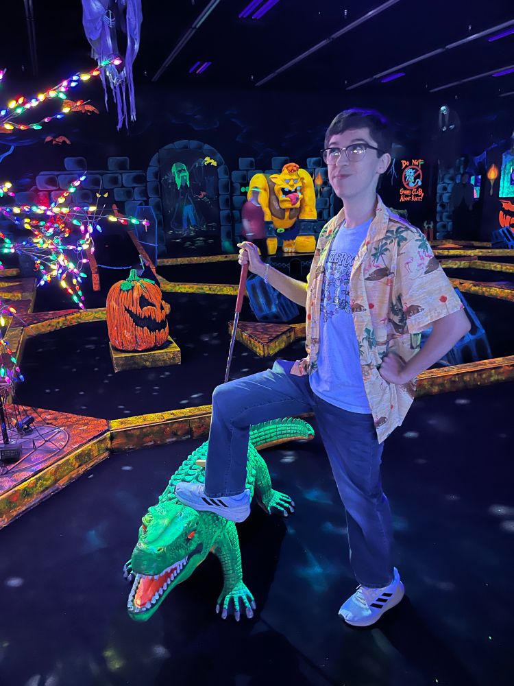 xavier showing monster mini-golf croc who's boss (he lost really badly)