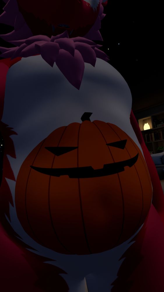 a three-quarters view of a fat pink nardo with a white belly with an orange jack-o'-lantern painted on. the camera is eye level with it's belly