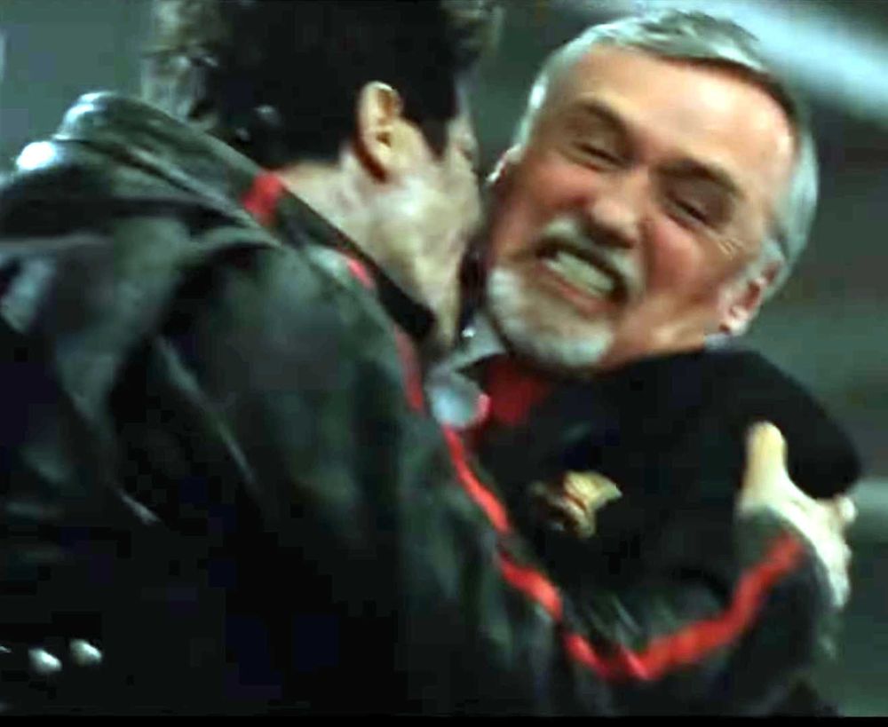 A scene from Romero's "Land of the Dead" in which a zombie starts to eat the plutocrat Paul Kaufman