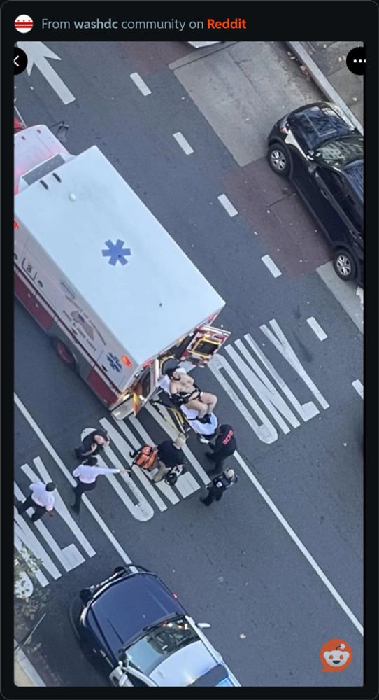 A photo of a large, almost nude man being loaded into an ambulance. The photo was taken from several floors up and shared to the local DC subreddit. 