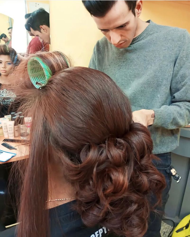 Andry José Hernández Romero, putting a client’s hair in rollers, now in a jail for terrorists where not only is he held in complete isolation, but where no one will confirm if he’s alive. 