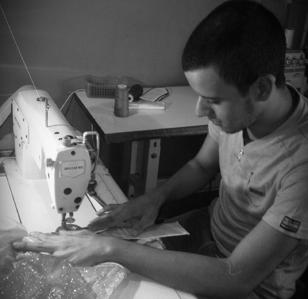 Andry José Hernández Romero making a costume for his hometown’s Three Kings Festival 