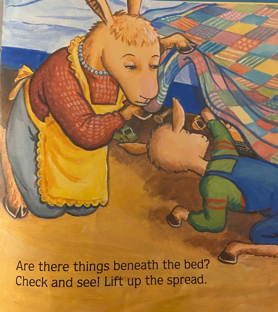 Mama Llama looking under the bed to reveal all the toys he’s shoved in there