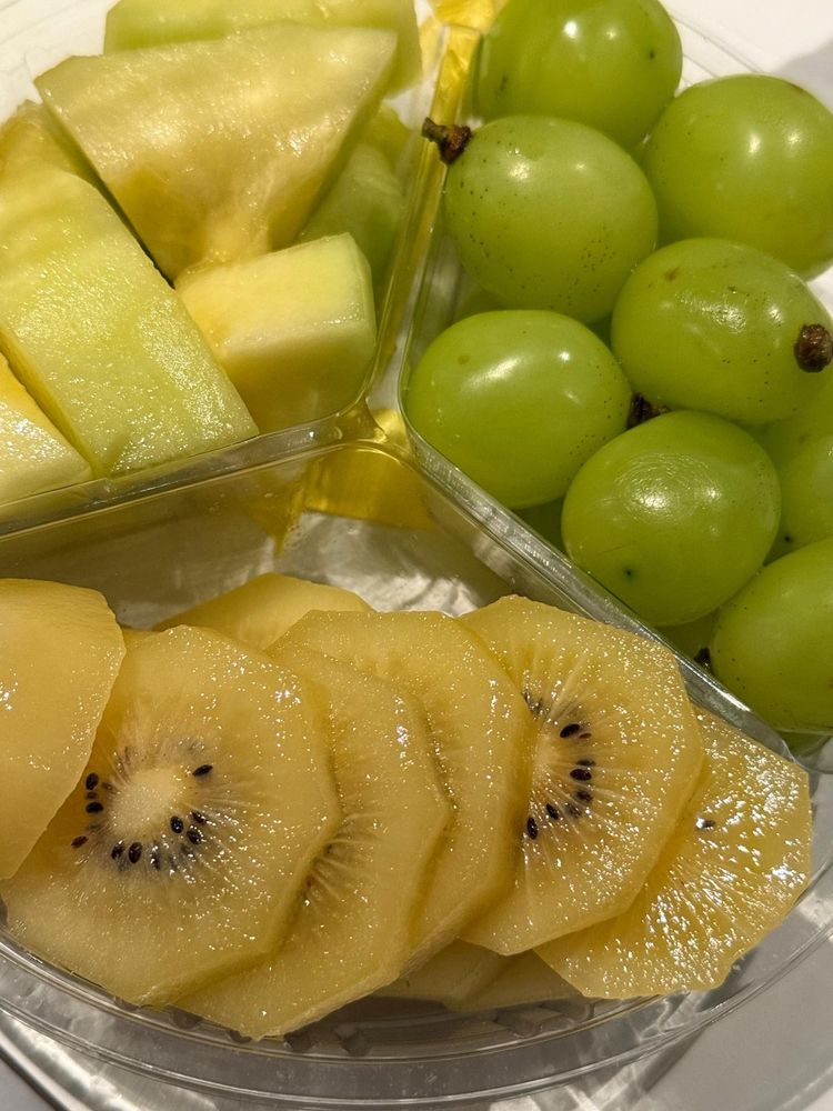 a container with three kinds of fruit