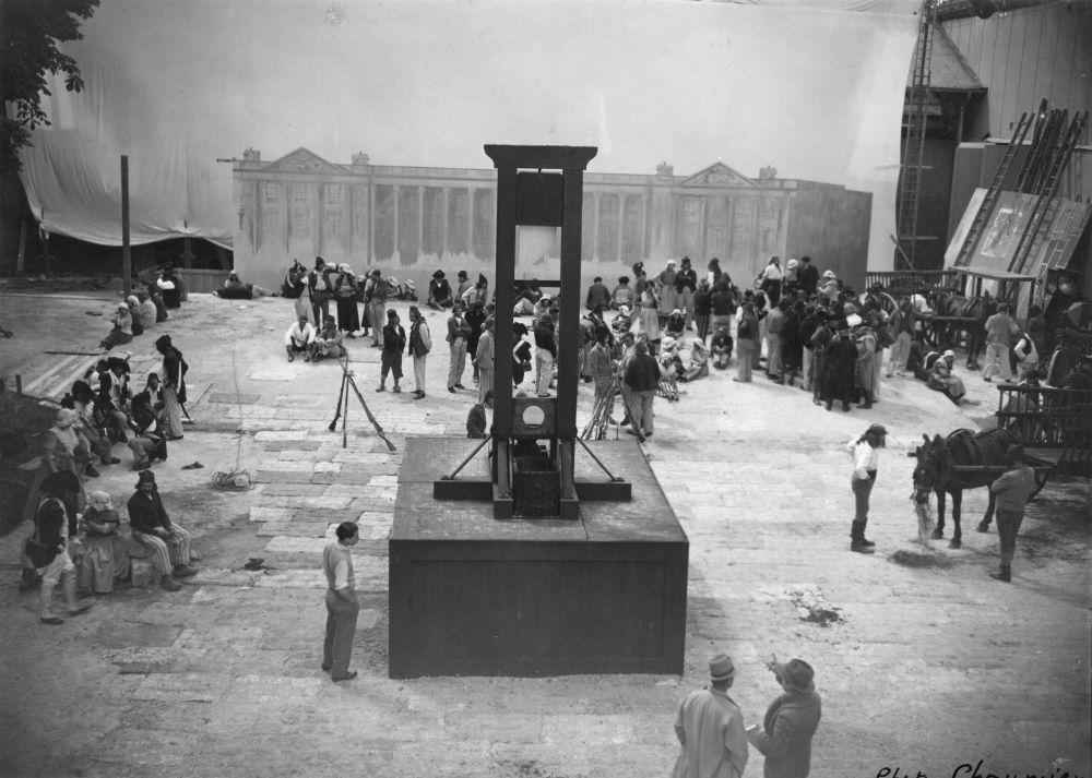 A guillotine sitting in a town square. 