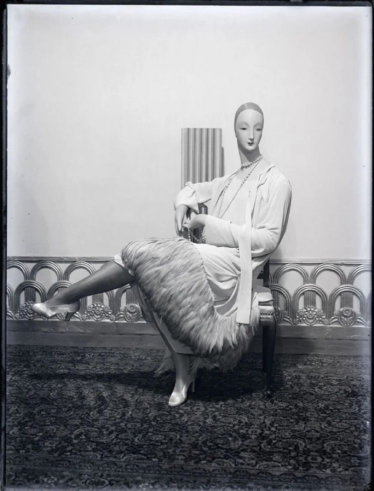 Photo of seated woman exhibit at 1925 Pavilion by Man Ray.